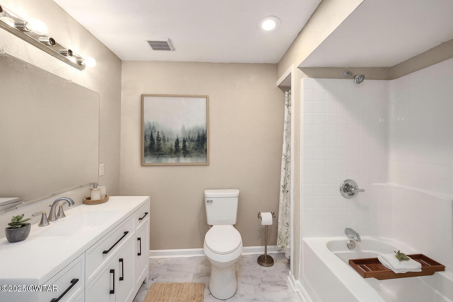 4135 Eurekaton Road Stanton, TN 38069 - Photo 13 of 33 a bathroom with a sink toilet and shower