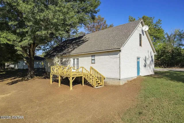 an aerial view of a house with outdoor space