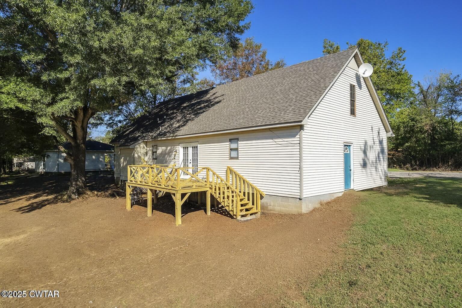 4135 Eurekaton Road Stanton, TN 38069 - Photo 20 of 33 a view of a house with a yard and garage