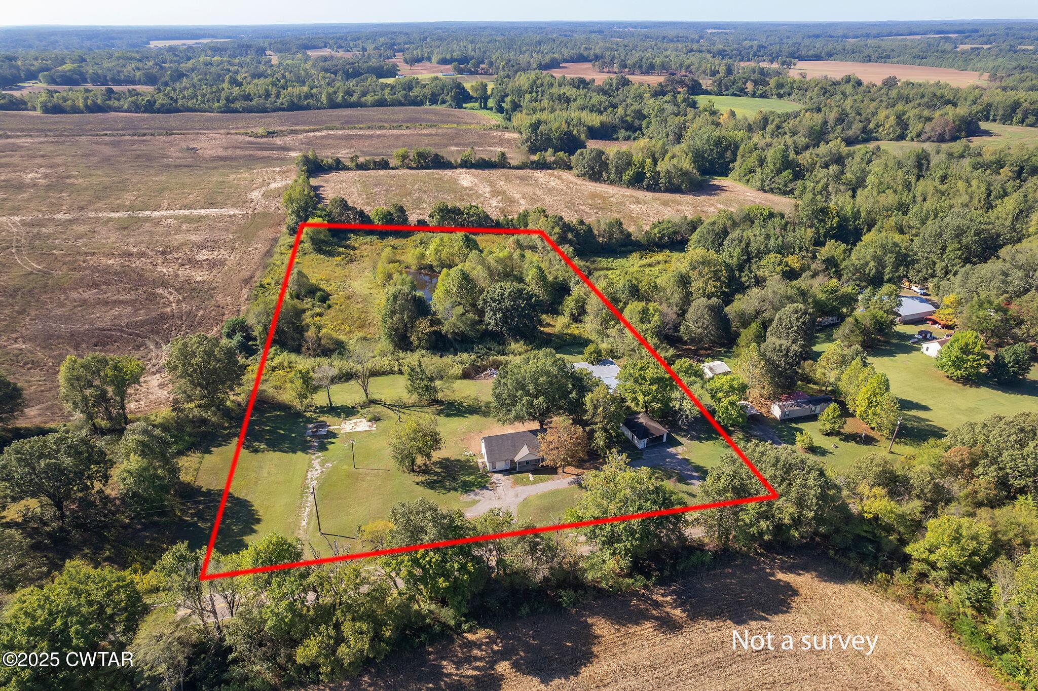 4135 Eurekaton Road Stanton, TN 38069 - Photo 31 of 33 an aerial view of a house with a lake view