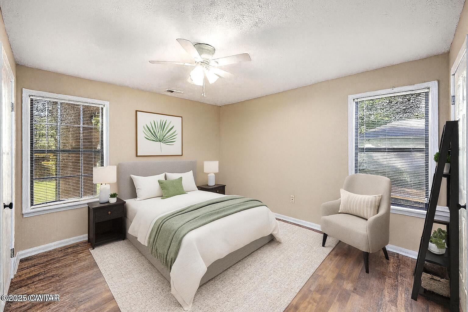 4135 Eurekaton Road Stanton, TN 38069 - Photo 9 of 33 a bedroom with a bed and wooden floor