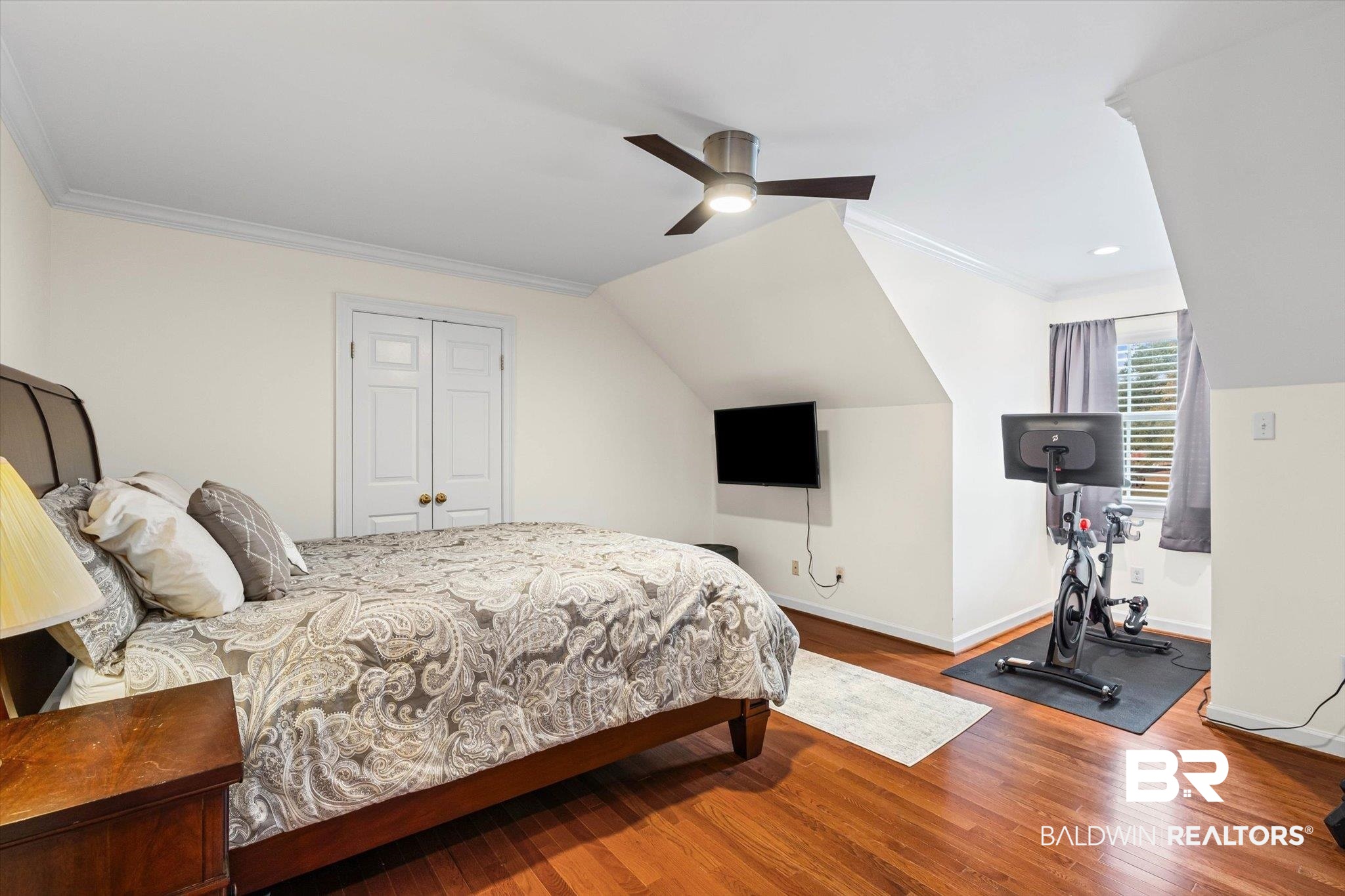 4851 Audubon Drive Mobile, AL 36619 - Photo 21 of 46 Bedroom featuring ornamental molding, wood finished floors, a closet, a ceiling fan, and vaulted ceiling