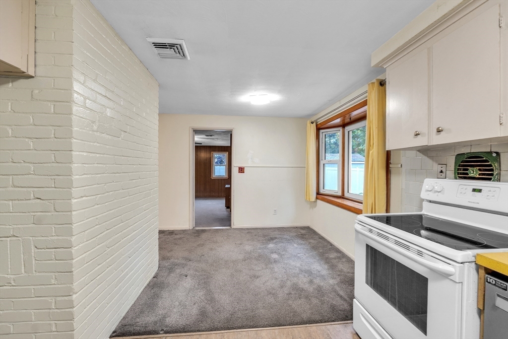 15 Fairbrook Road Framingham, MA 01701 - Photo 11 of 28 a kitchen with stainless steel appliances granite countertop a stove a sink and a refrigerator