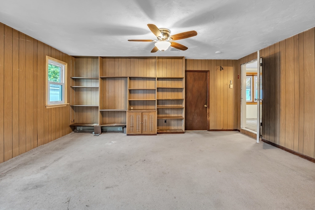 15 Fairbrook Road Framingham, MA 01701 - Photo 15 of 28 an empty room with a ceiling fan window and a ceiling fan