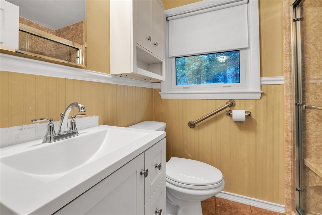 15 Fairbrook Road Framingham, MA 01701 - Photo 17 of 28 a bathroom with a sink a toilet and a window