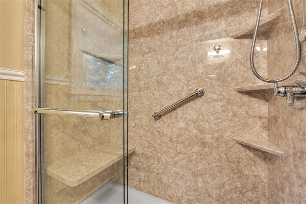 15 Fairbrook Road Framingham, MA 01701 - Photo 18 of 28 a bathroom with a mirror shower and vanity