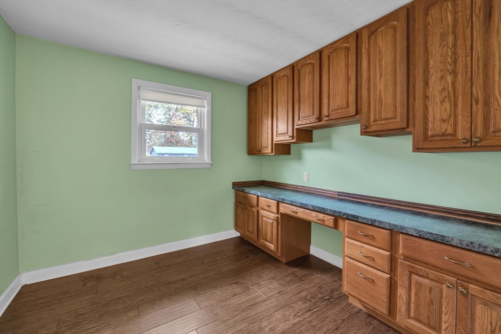 15 Fairbrook Road Framingham, MA 01701 - Photo 20 of 28 a room with wooden cabinets and a window