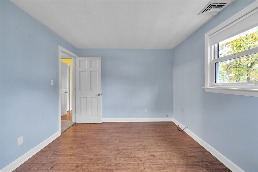 15 Fairbrook Road Framingham, MA 01701 - Photo 22 of 28 wooden floor in an empty room with a window