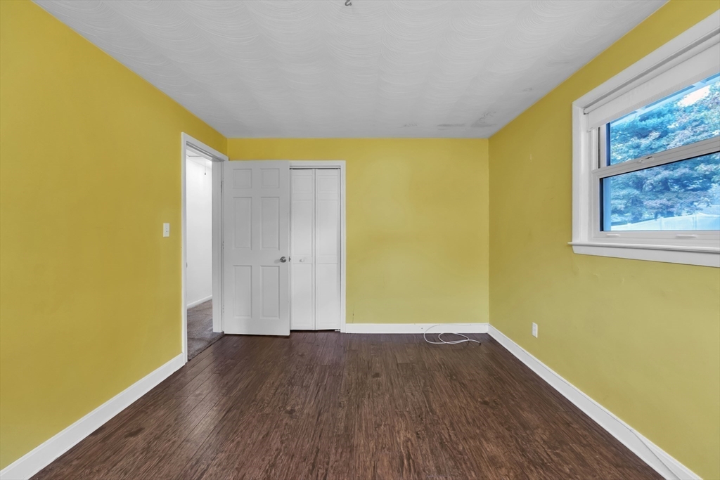 15 Fairbrook Road Framingham, MA 01701 - Photo 23 of 28 a view of empty room with wooden floor