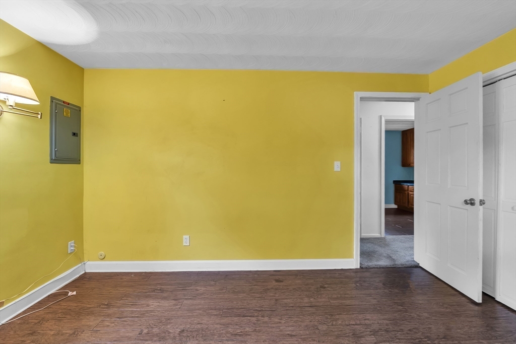 15 Fairbrook Road Framingham, MA 01701 - Photo 24 of 28 a view of an empty room with wooden floor and a window