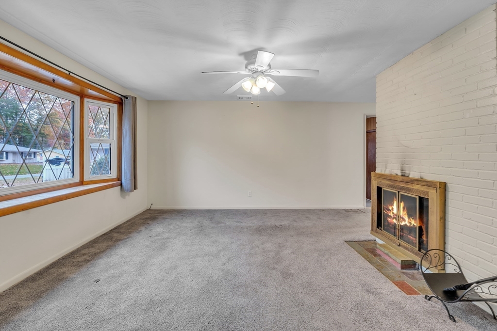 15 Fairbrook Road Framingham, MA 01701 - Photo 4 of 28 a view of an empty room with a window