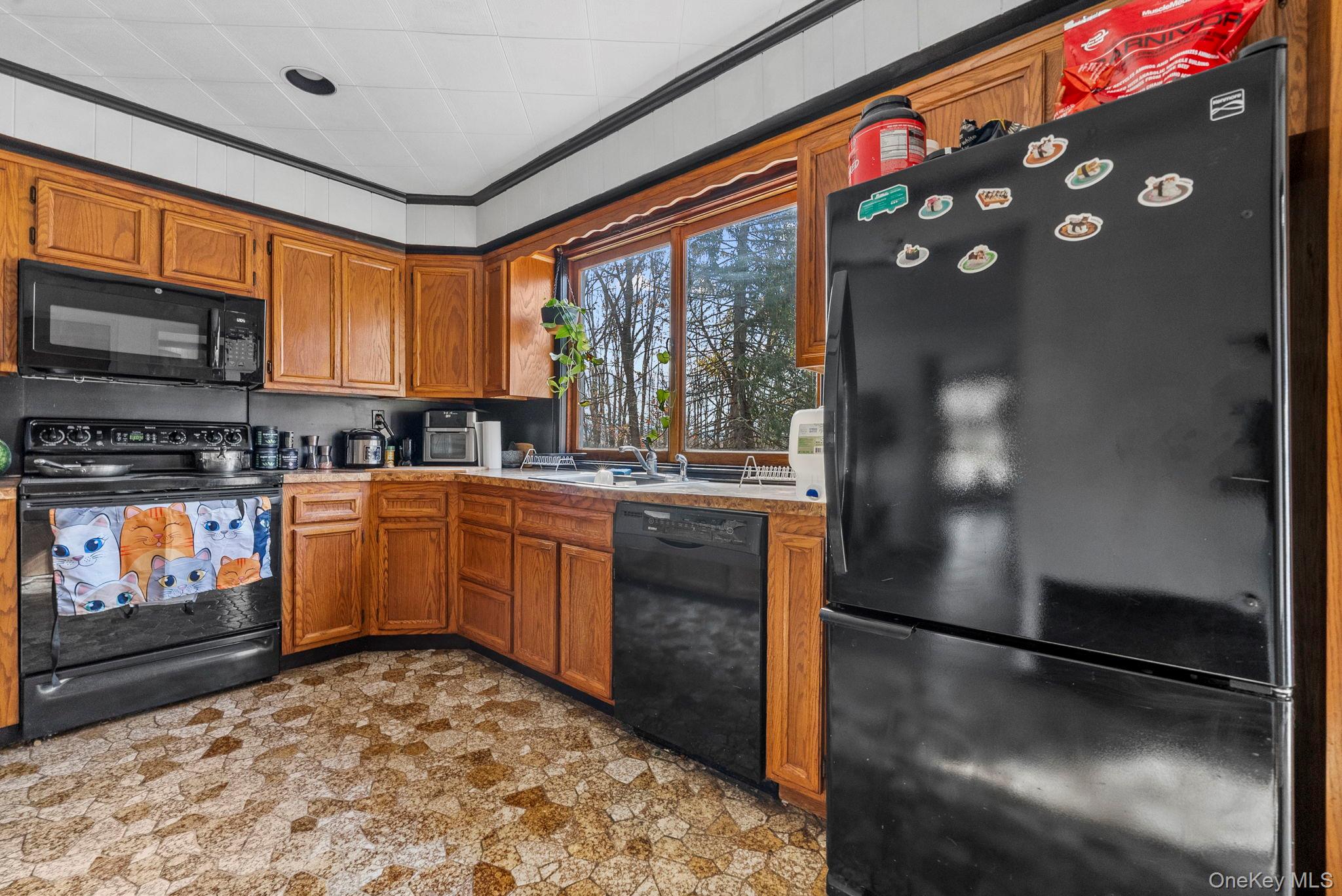 45 Baker Road Hopewell Junction, NY 12533 - Photo 15 of 41 a kitchen with stainless steel appliances granite countertop a refrigerator a stove a sink and a microwave