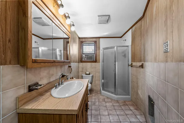 a bathroom with a sink a mirror and a shower