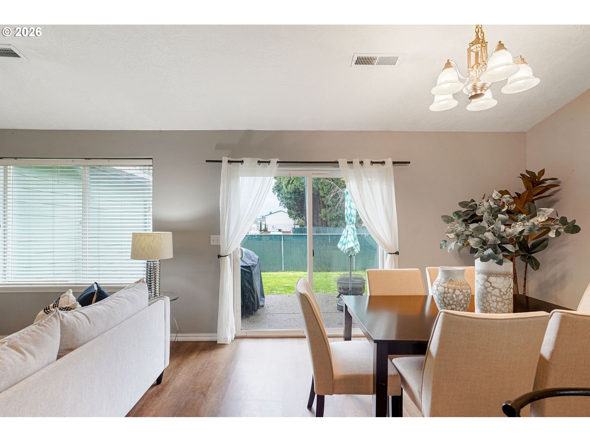 4791 Currant Lane Northeast Salem, OR 97305 - Photo 11 of 42 a living room with furniture a chandelier and a dining room