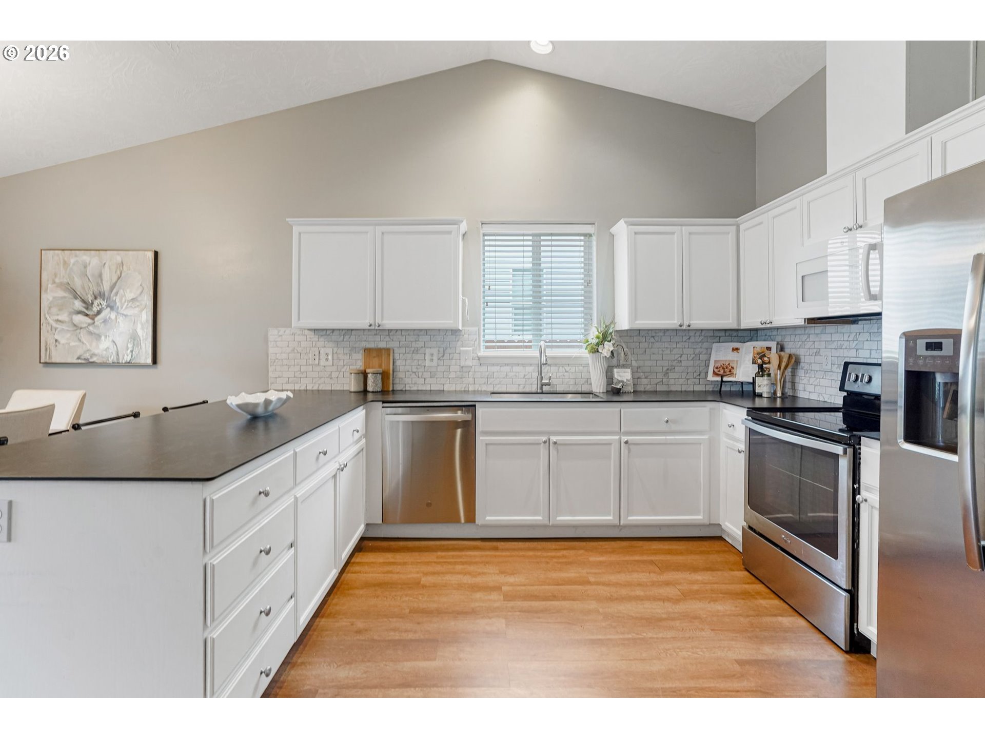 4791 Currant Lane Northeast Salem, OR 97305 - Photo 14 of 42 a kitchen with granite countertop a sink stainless steel appliances and cabinets