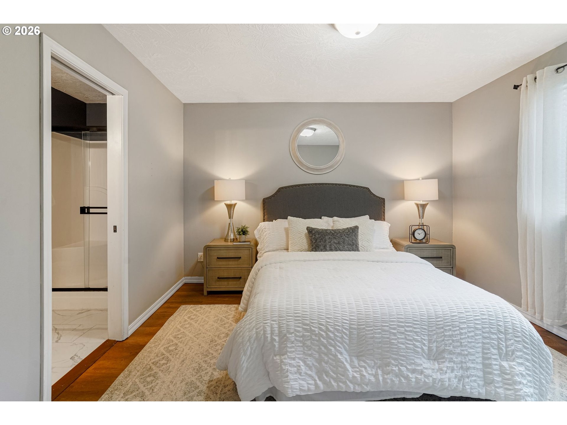 4791 Currant Lane Northeast Salem, OR 97305 - Photo 23 of 42 a bedroom with a bed and wooden floor