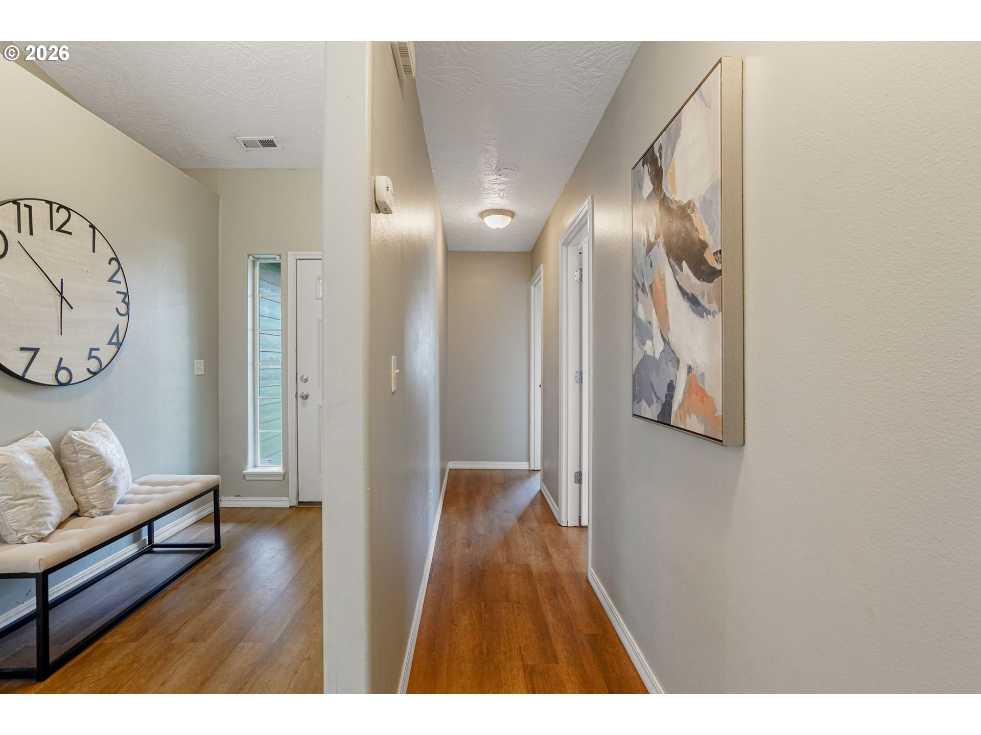 4791 Currant Lane Northeast Salem, OR 97305 - Photo 29 of 42 a view of a hallway with wooden floor