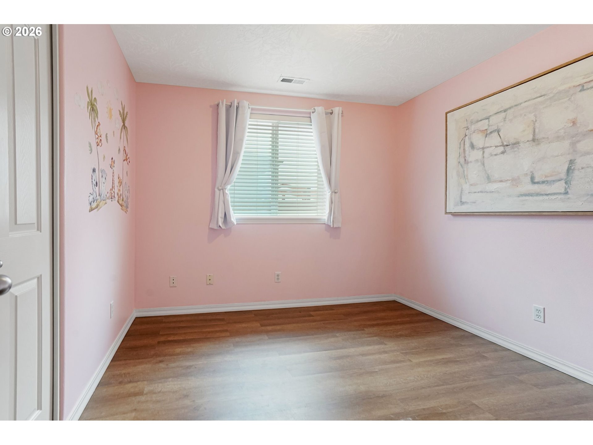 4791 Currant Lane Northeast Salem, OR 97305 - Photo 31 of 42 a view of an empty room with wooden floor and a window
