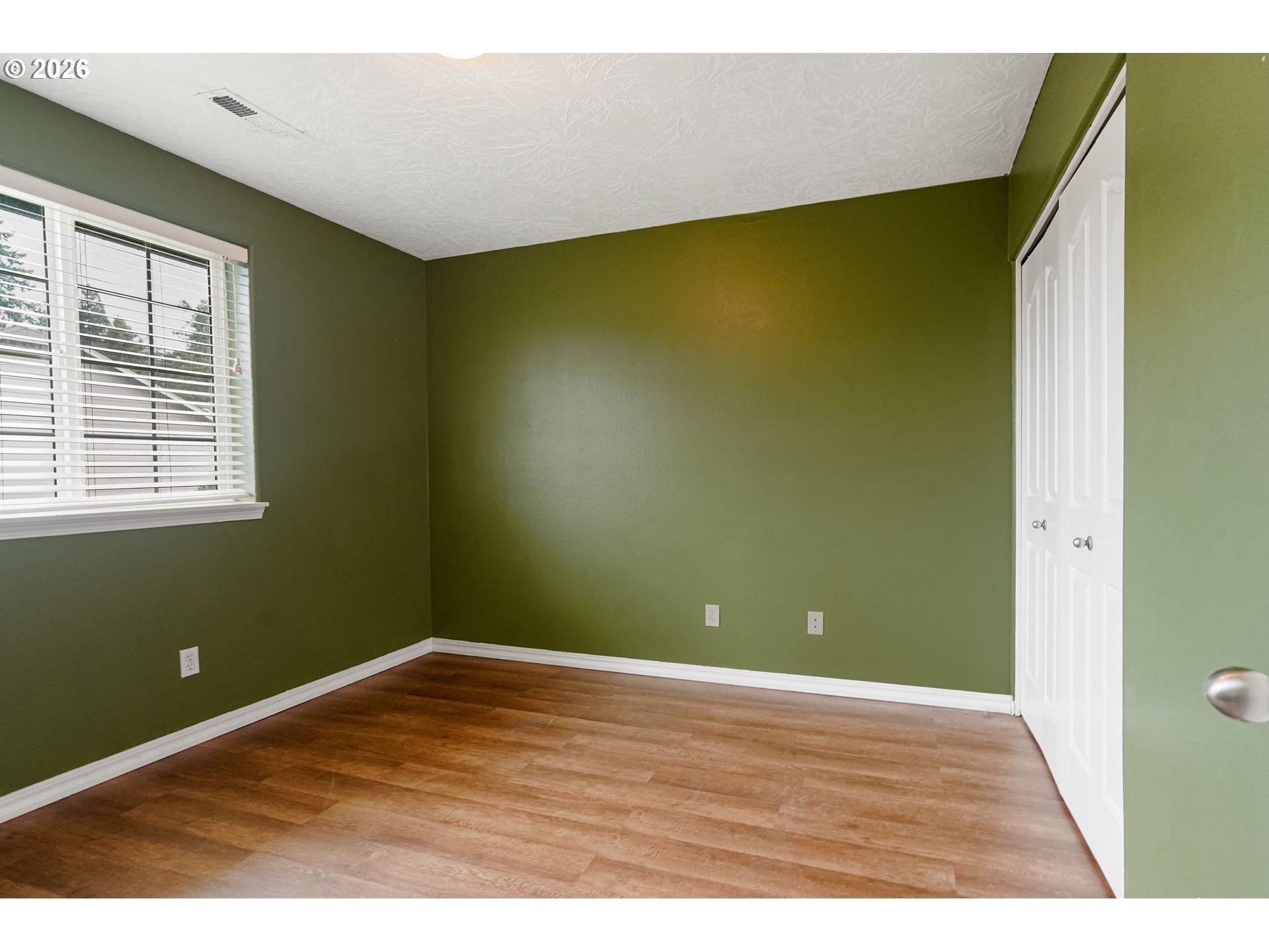 4791 Currant Lane Northeast Salem, OR 97305 - Photo 33 of 42 a view of empty room with wooden floor and fan