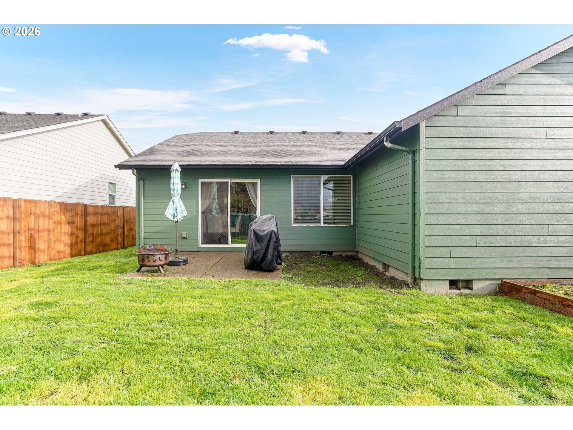 4791 Currant Lane Northeast Salem, OR 97305 - Photo 38 of 42 a backyard of a house with table and chairs