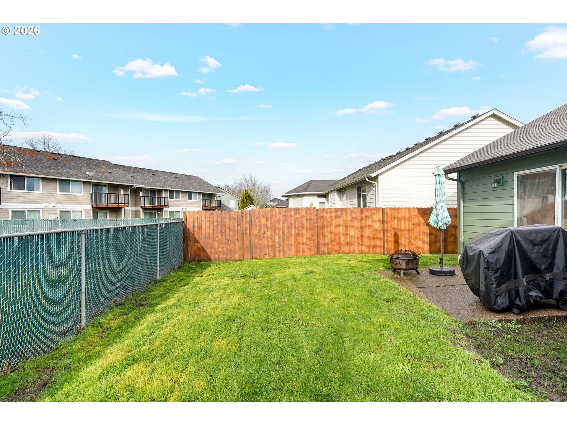 4791 Currant Lane Northeast Salem, OR 97305 - Photo 39 of 42 a backyard of a house with table and chairs
