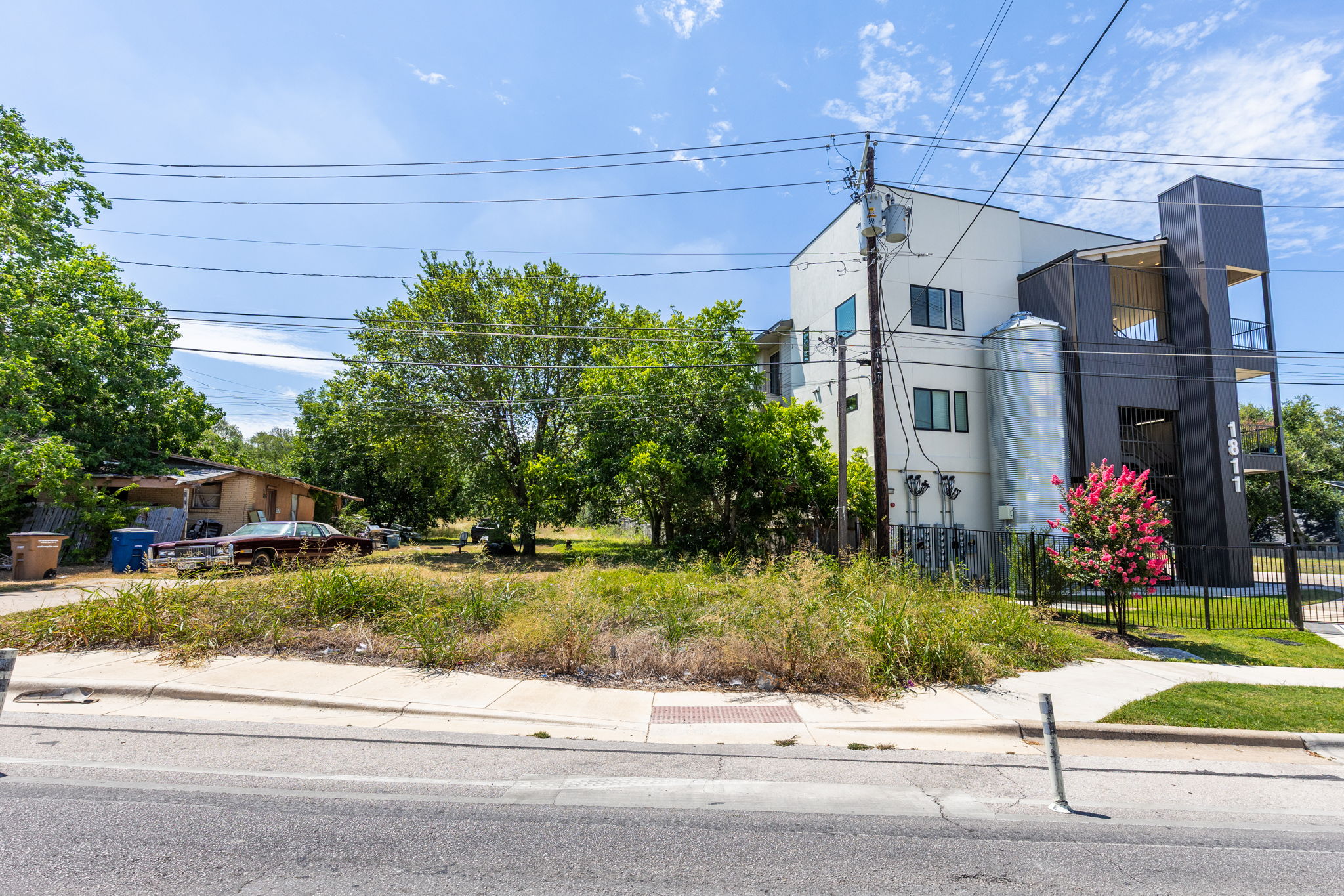 1813 Webberville Road Austin, TX 78721 - Photo 20 of 20 A prime corner lot with a contemporary multi-story building, offering versatile development potential.