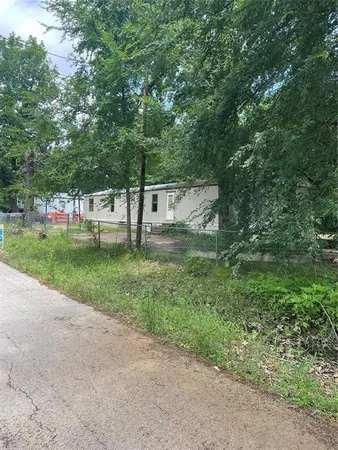 a view of backyard with green space