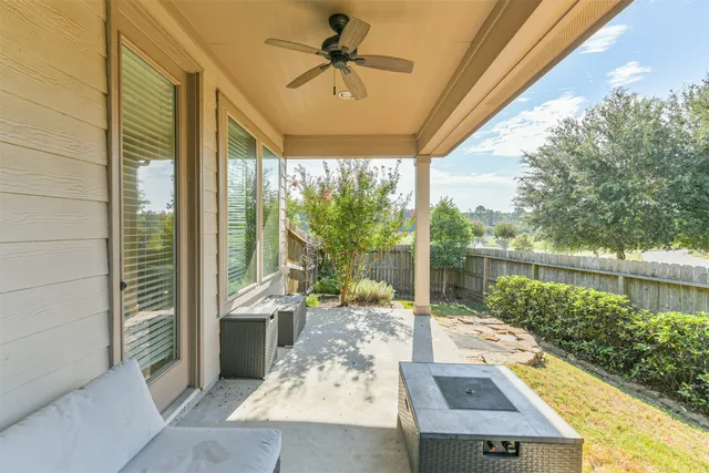 a view of a balcony with lake view and a floor to ceiling window