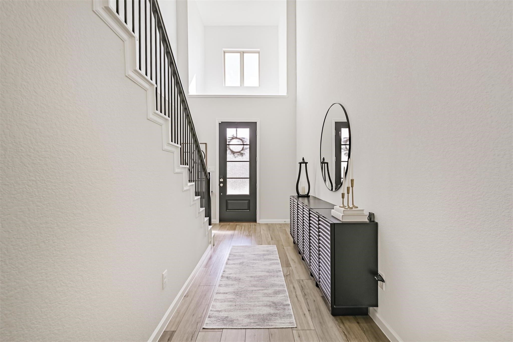 5010 Walnut Grv Lane Manvel, TX 77578 - Photo 9 of 46 a hallway with wooden floor staircase