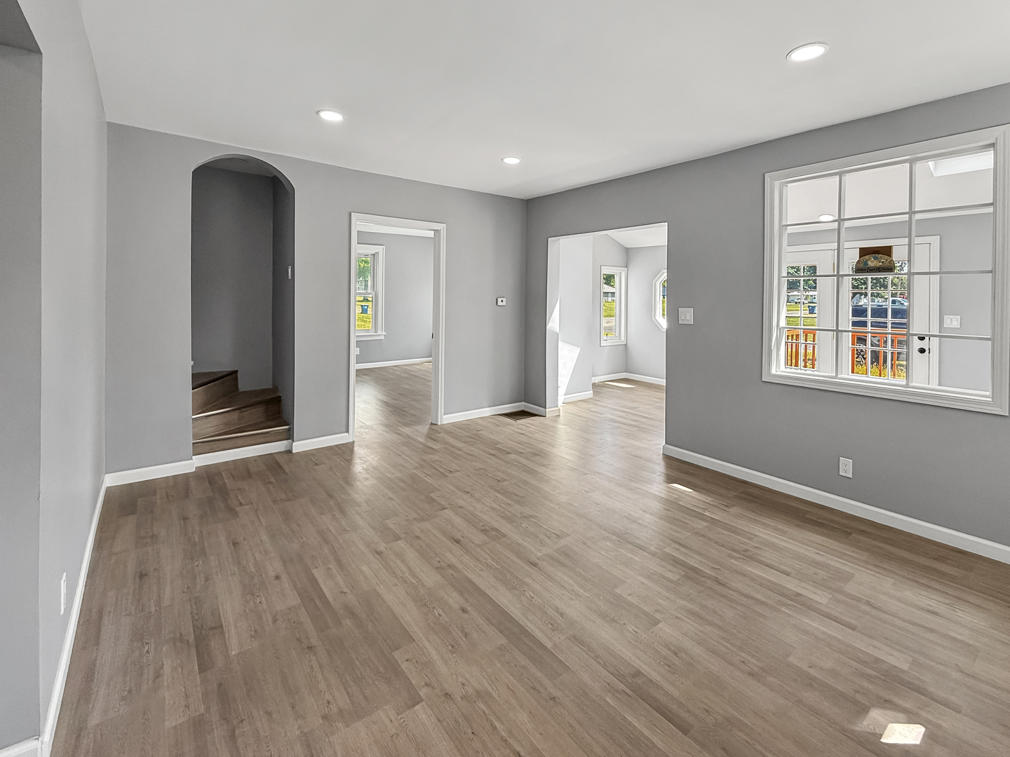 302 West Cook Street Sheffield, IL 61361 - Photo 6 of 18 an empty room with wooden floor and windows