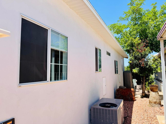 150 North 3050 East, Unit 4 St. George, UT 84790 - Photo 4 of 24 Exterior wall with multiple windows and white siding