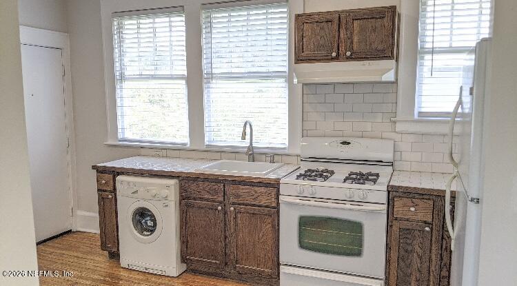 2314 Forbes Street, Unit B Jacksonville, FL 32204 - Photo 3 of 12 a kitchen with a stove and cabinets