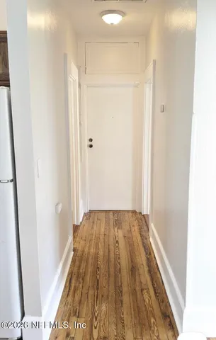 a view of bathroom with wooden floor