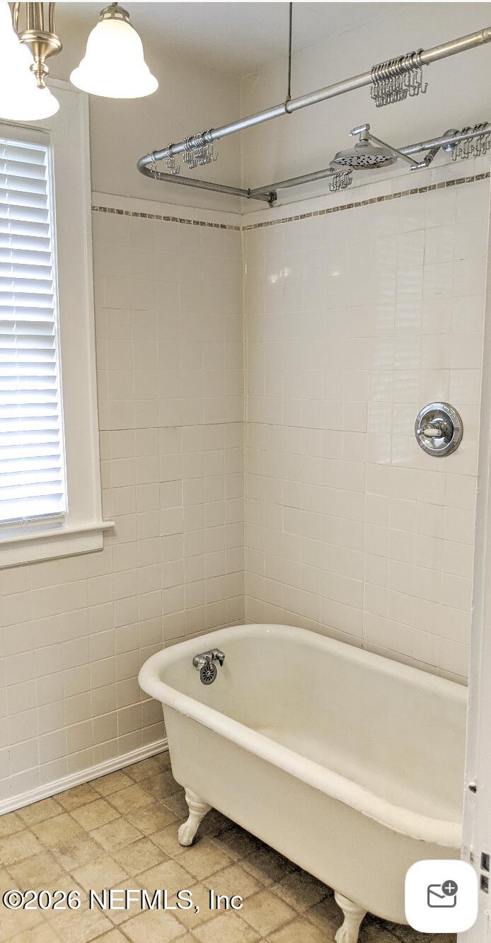 2314 Forbes Street, Unit B Jacksonville, FL 32204 - Photo 6 of 12 a bathroom with a bathtub and a shower