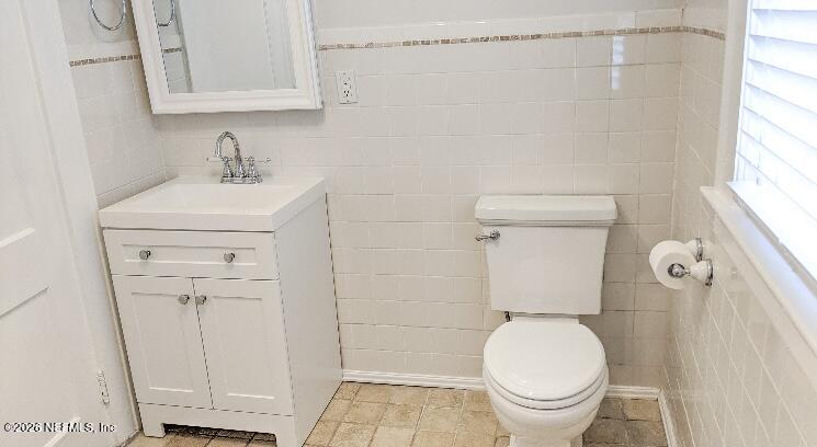 2314 Forbes Street, Unit B Jacksonville, FL 32204 - Photo 7 of 12 a white toilet sitting next to a bathroom sink