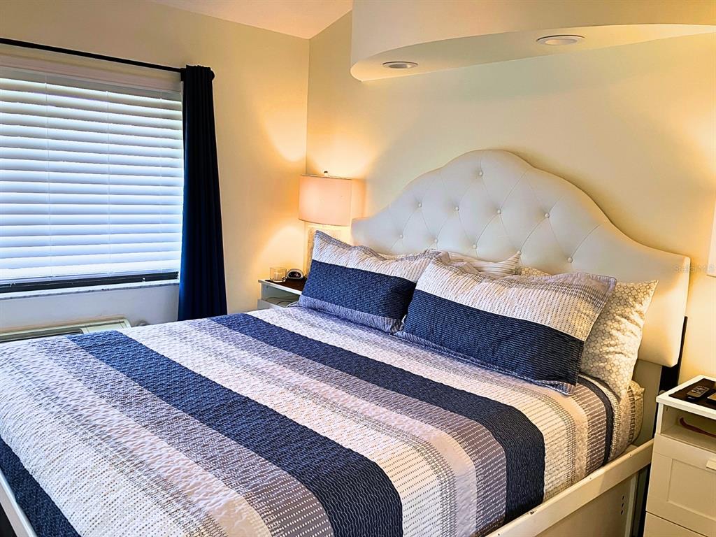 20921 Haulover Cove Road, Unit F2 Lutz, FL 33558 - Photo 19 of 30 a bedroom with a bed and a window
