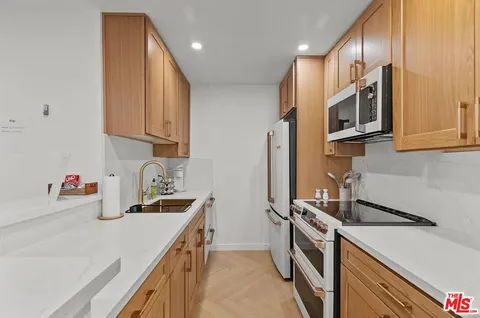 a kitchen with a stove and a microwave