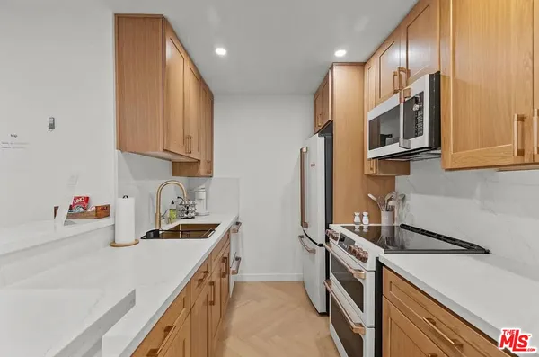 a kitchen with a stove and a microwave