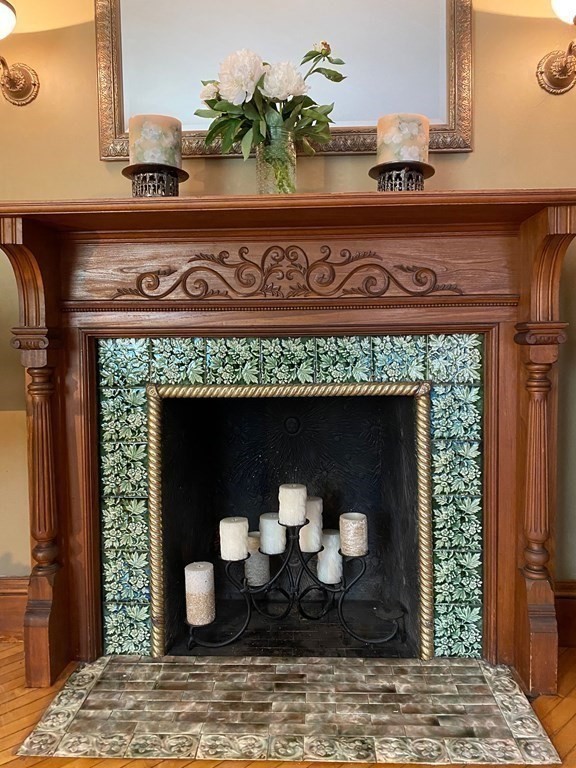 39 Maple Street Stoneham, MA 02180 - Photo 11 of 40 a closeup of a fireplace with a hallway
