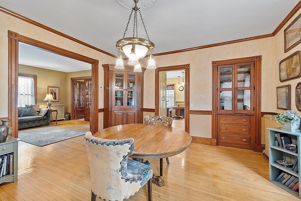 39 Maple Street Stoneham, MA 02180 - Photo 15 of 40 a view of a dining room with furniture wooden floor and chandelier