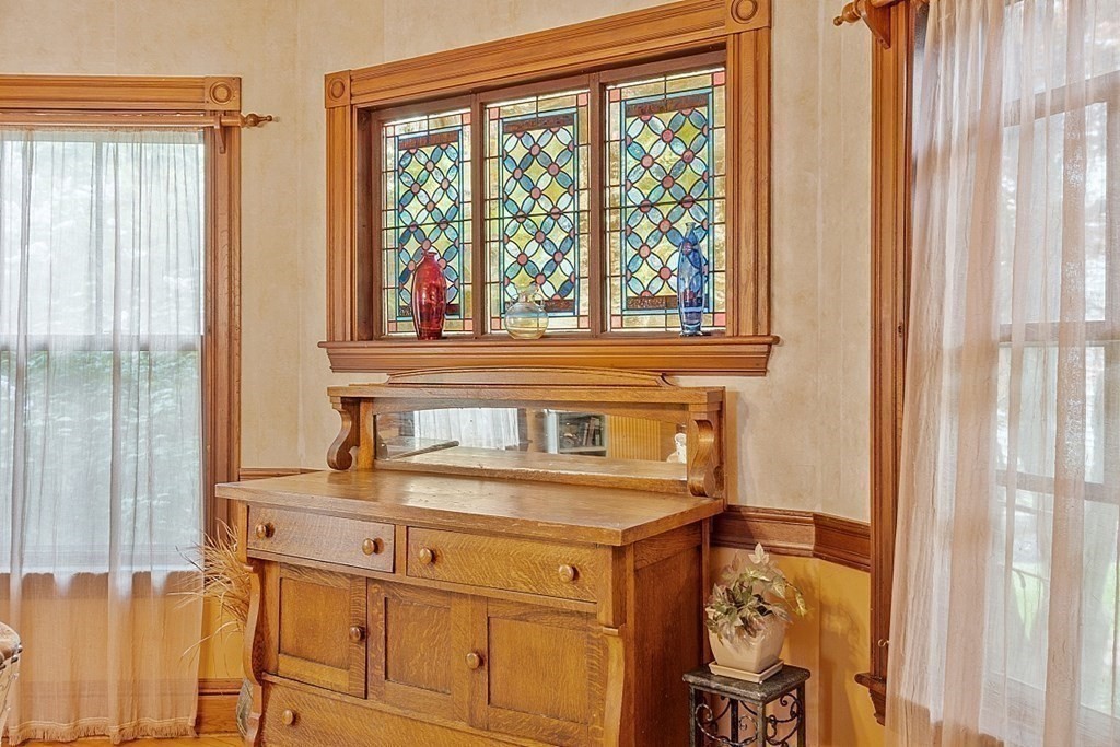 39 Maple Street Stoneham, MA 02180 - Photo 16 of 40 a bathroom with a sink and a large mirror