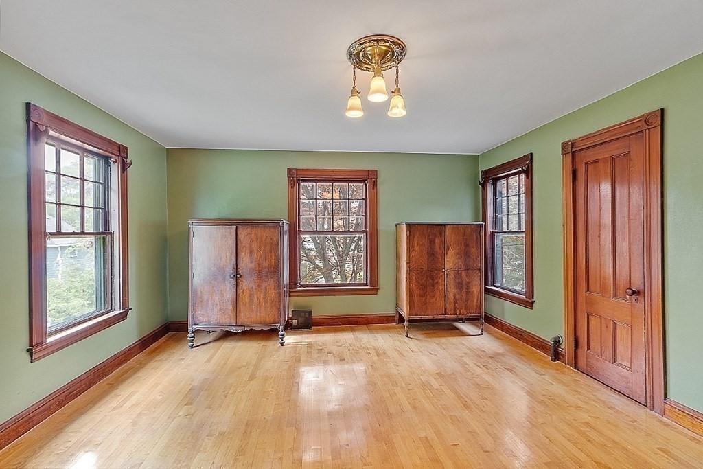 39 Maple Street Stoneham, MA 02180 - Photo 24 of 40 an empty room with windows closet and windows
