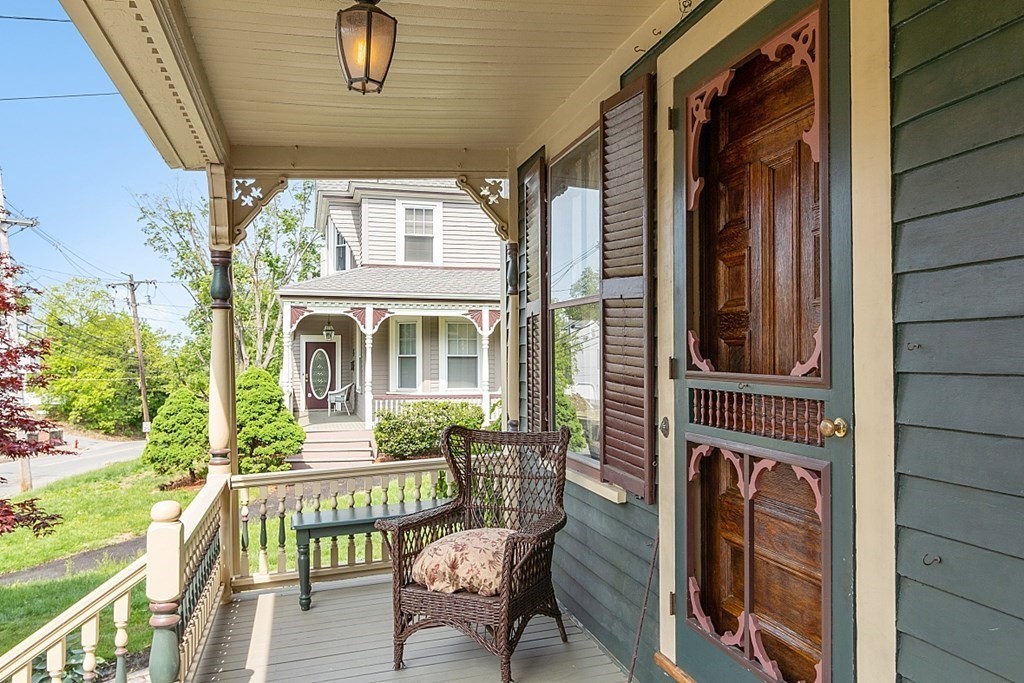 39 Maple Street Stoneham, MA 02180 - Photo 3 of 40 a view of a chair and table in the balcony