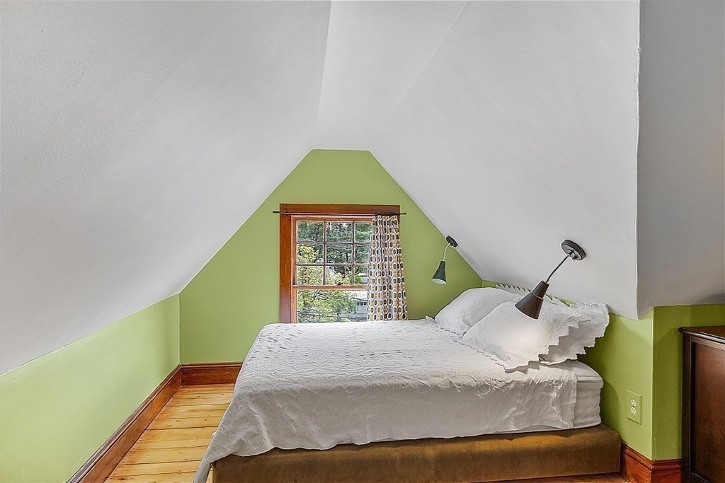 39 Maple Street Stoneham, MA 02180 - Photo 32 of 40 a bedroom with a bed and a window