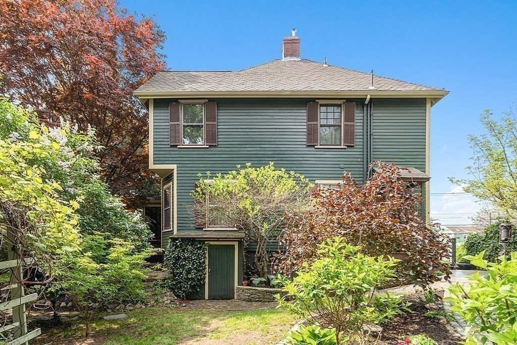 39 Maple Street Stoneham, MA 02180 - Photo 35 of 40 a front view of a house with garden