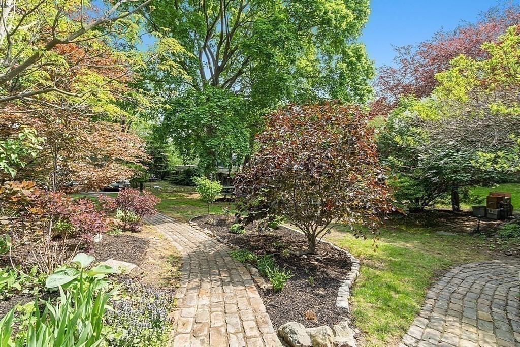 39 Maple Street Stoneham, MA 02180 - Photo 36 of 40 a backyard of a house with lots of green space
