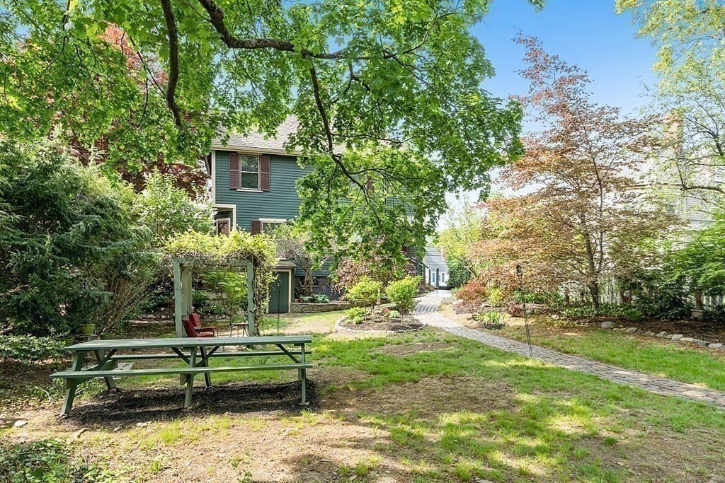 39 Maple Street Stoneham, MA 02180 - Photo 37 of 40 a view of a house with a yard