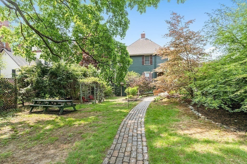 39 Maple Street Stoneham, MA 02180 - Photo 38 of 40 a front view of a house with a yard