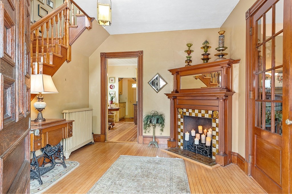 39 Maple Street Stoneham, MA 02180 - Photo 5 of 40 a view of living room filled with furniture and wooden floor