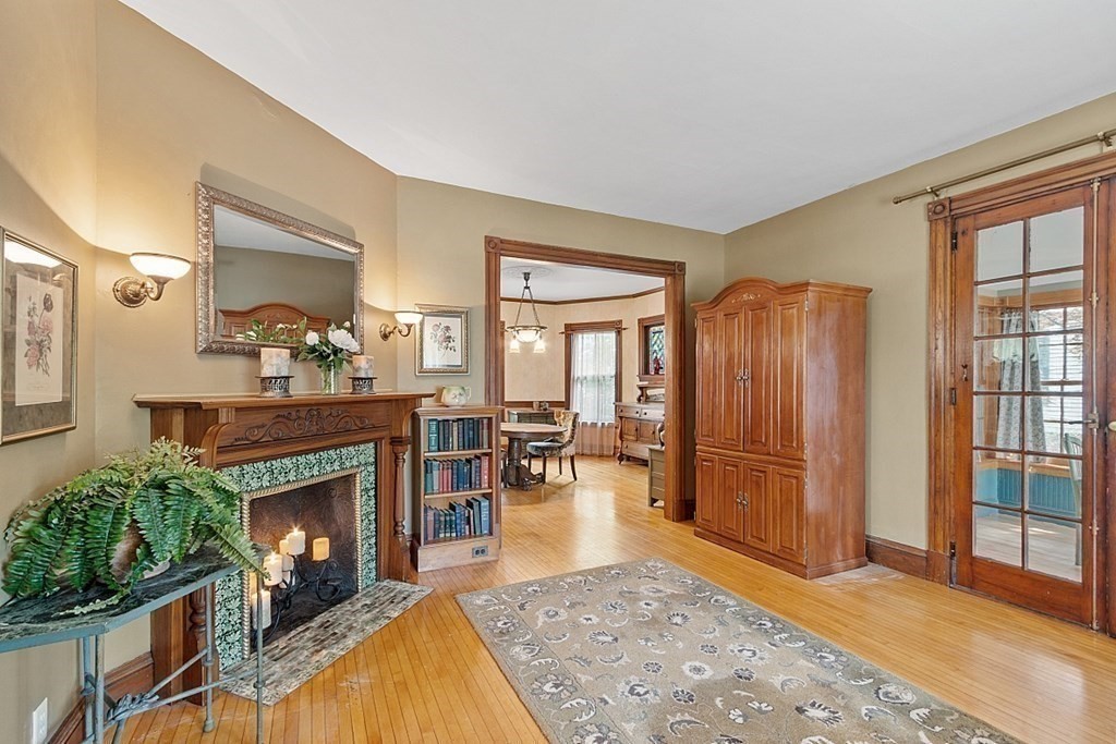 39 Maple Street Stoneham, MA 02180 - Photo 10 of 40 a living room with furniture and a fireplace